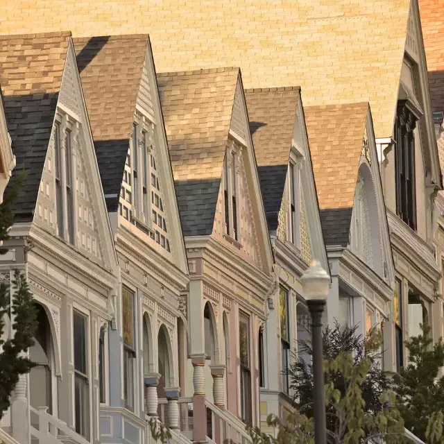 Close up of a row of Victorian houses in the Castro district of San Francisco.